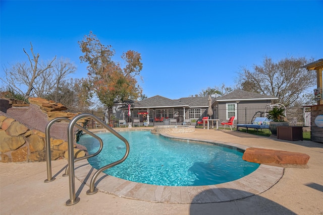 view of swimming pool featuring a patio