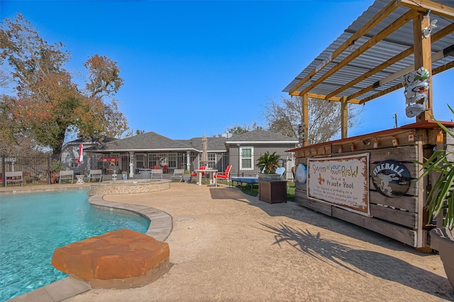 view of pool featuring a patio area and a pergola