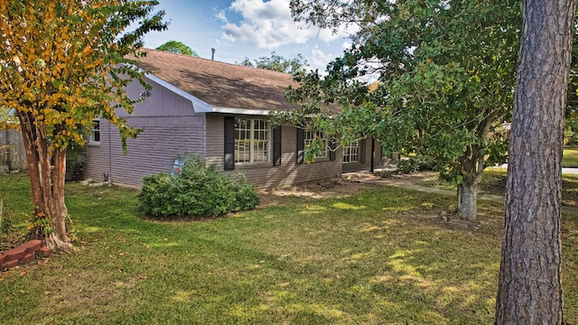 view of home's exterior featuring a yard