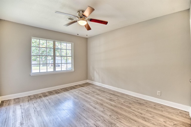 unfurnished room featuring ceiling fan and light hardwood / wood-style flooring