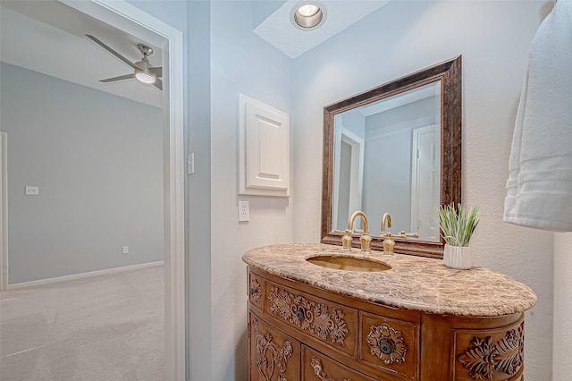 bathroom with ceiling fan and vanity