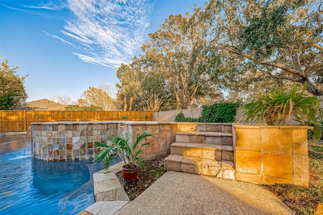 exterior space with pool water feature