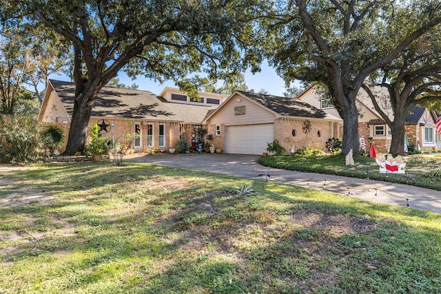 view of front of home with a front lawn and a garage