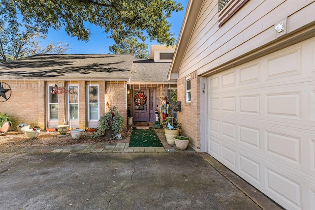 doorway to property featuring a garage