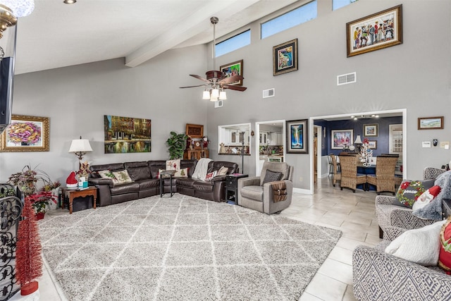 living room with beamed ceiling, high vaulted ceiling, ceiling fan, and light tile patterned flooring