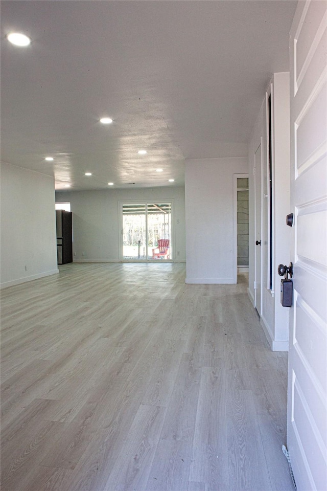 spare room featuring light wood-type flooring