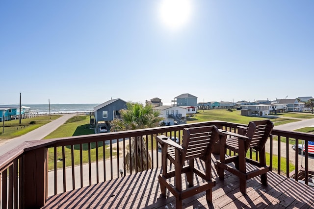 wooden terrace featuring a water view