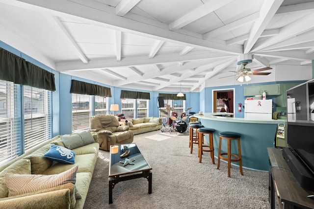 carpeted living room with beam ceiling and ceiling fan