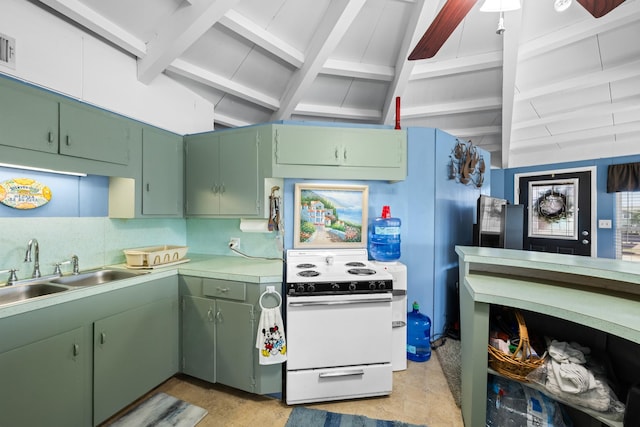 kitchen with sink, white stove, green cabinets, and backsplash