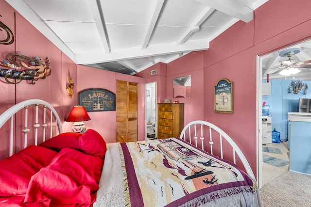 bedroom featuring stainless steel fridge, vaulted ceiling with beams, and ceiling fan