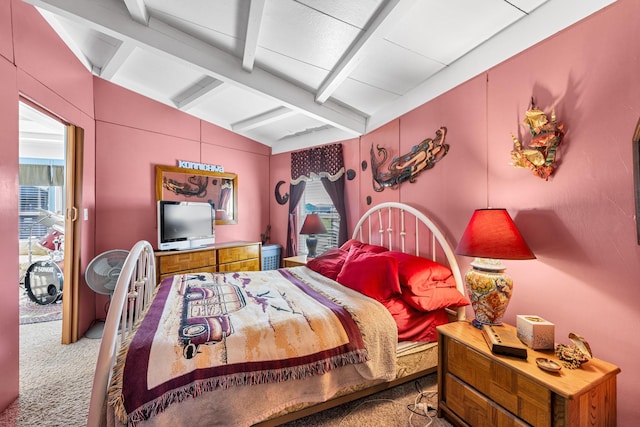 bedroom featuring carpet and vaulted ceiling with beams