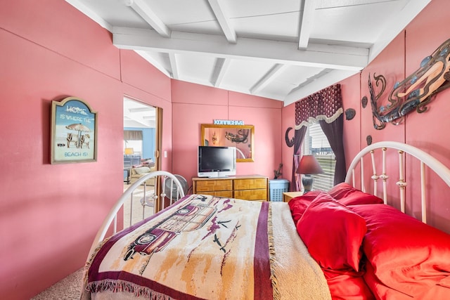 carpeted bedroom with vaulted ceiling with beams