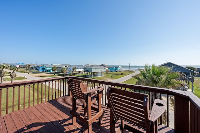 wooden deck with a water view