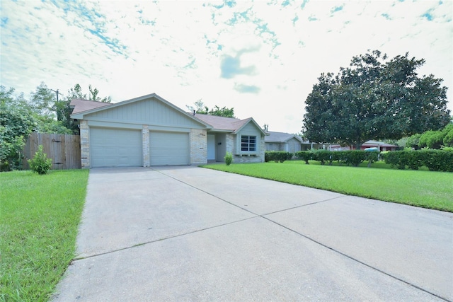 ranch-style home featuring a garage and a front lawn