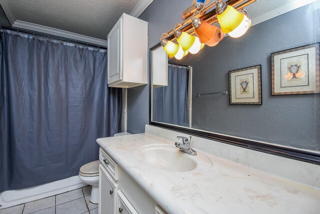 bathroom with toilet, tile patterned floors, crown molding, vanity, and a textured ceiling