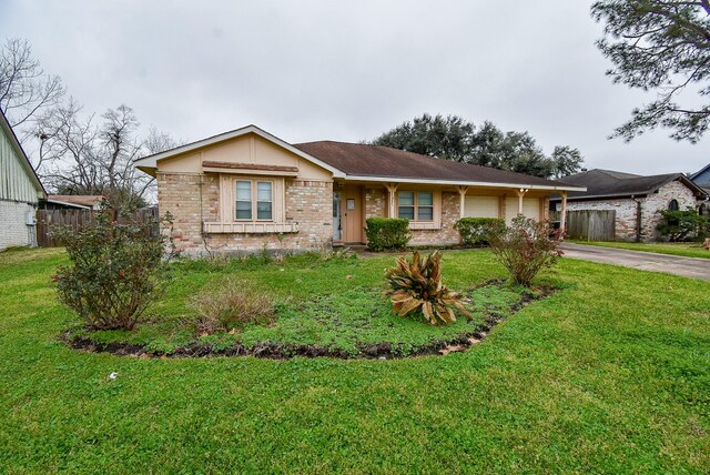 ranch-style house featuring aphalt driveway, brick siding, a front yard, fence, and a garage