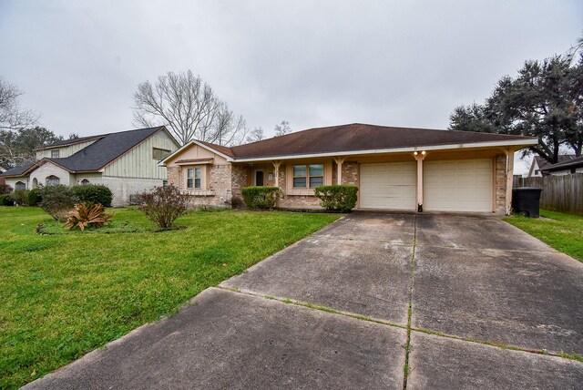 single story home featuring brick siding, concrete driveway, an attached garage, fence, and a front lawn