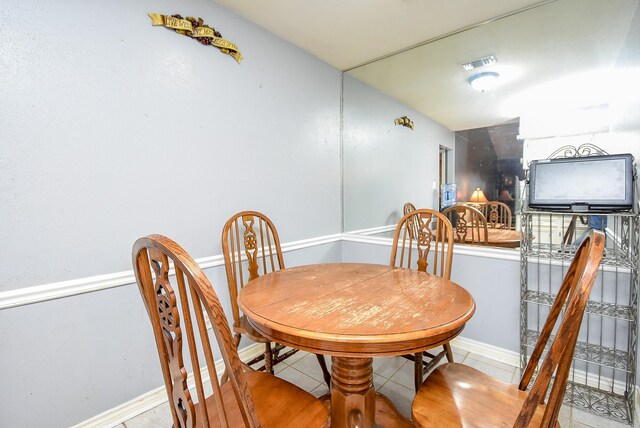 dining area featuring baseboards and visible vents