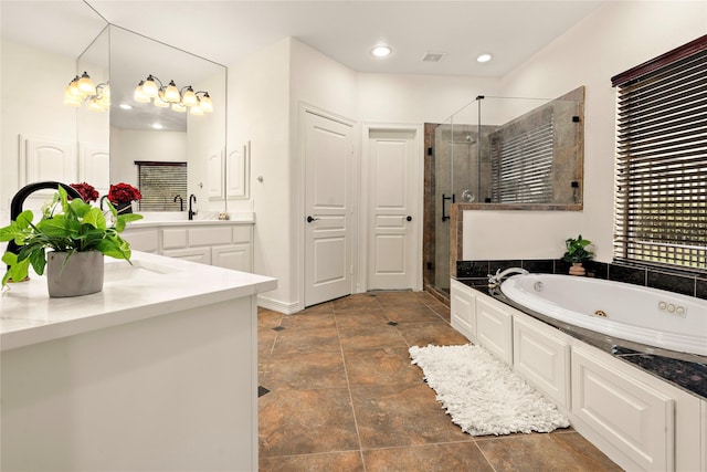 bathroom featuring vanity and shower with separate bathtub