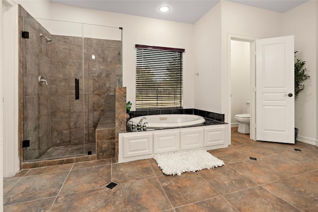 bathroom with shower with separate bathtub and toilet