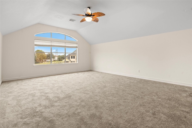 additional living space featuring ceiling fan, carpet, and vaulted ceiling