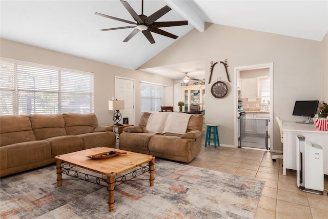 tiled living room featuring beam ceiling and high vaulted ceiling