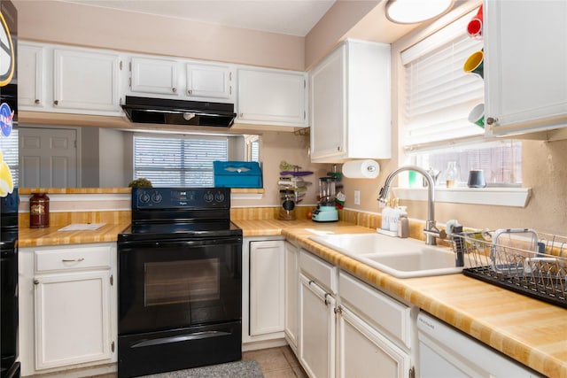 kitchen featuring white cabinetry, electric range, sink, white dishwasher, and light tile patterned flooring