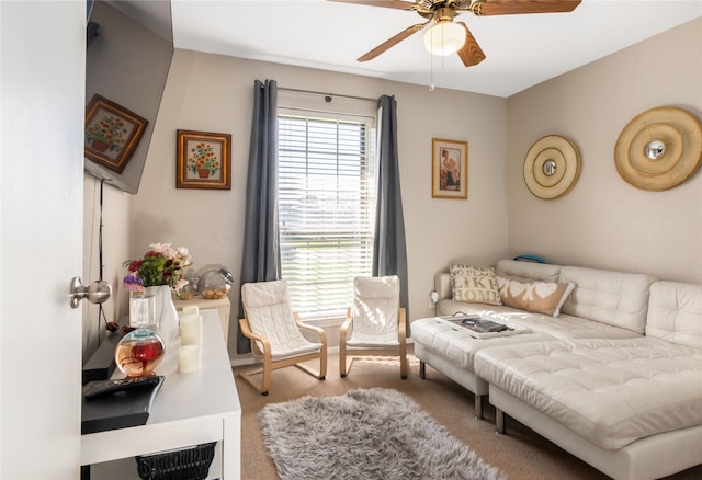 interior space with light carpet and ceiling fan