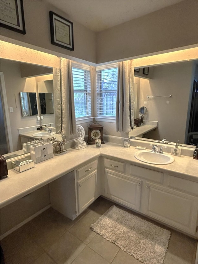 bathroom with tile patterned floors and vanity