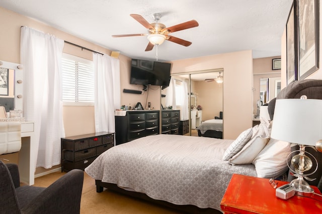 carpeted bedroom with a closet and ceiling fan