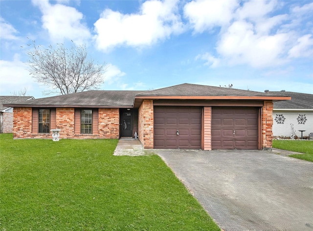 ranch-style house featuring a garage and a front lawn