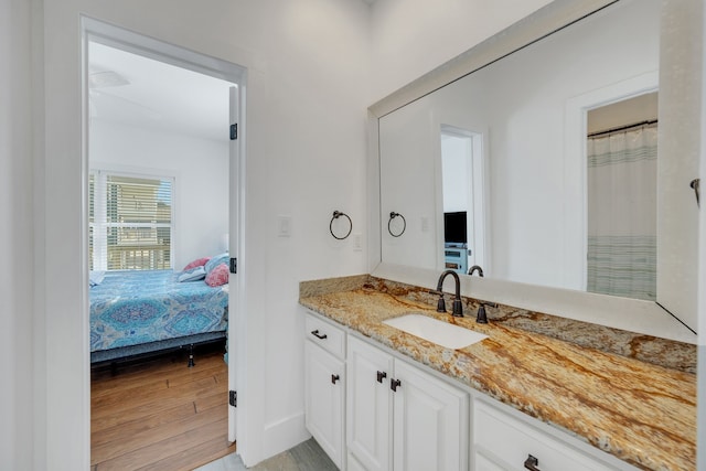 bathroom featuring hardwood / wood-style floors and vanity