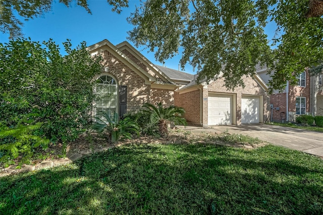 view of front of property with a front yard and a garage