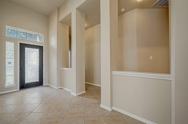 foyer entrance featuring light tile patterned floors