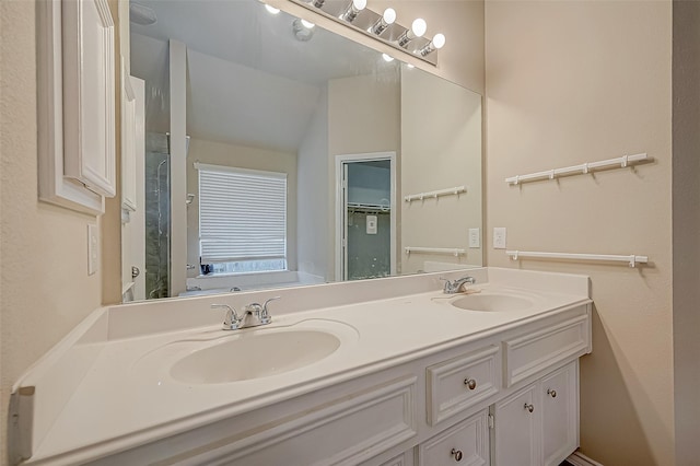 bathroom featuring vanity and vaulted ceiling