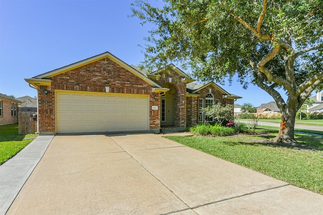 view of front of house with a garage and a front yard