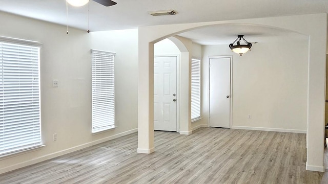 spare room featuring ceiling fan and light wood-type flooring