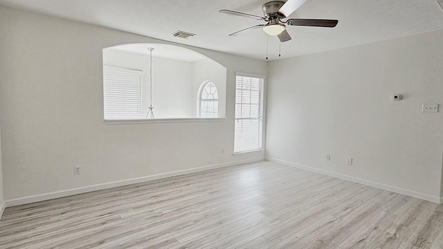 empty room with ceiling fan and light wood-type flooring