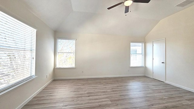 unfurnished room featuring ceiling fan, wood-type flooring, and lofted ceiling