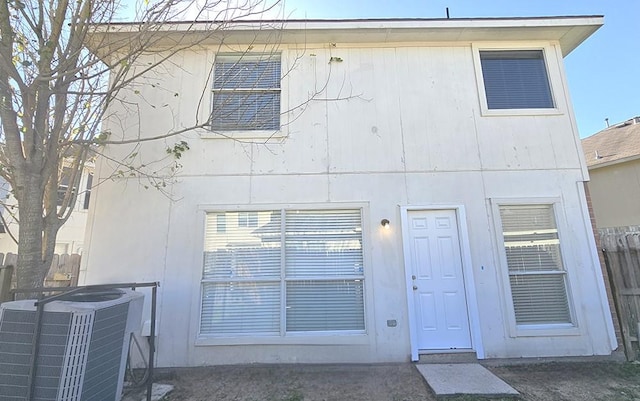 back of property with central AC unit