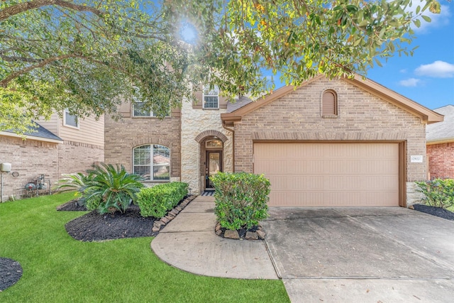 view of front of property with a front lawn and a garage