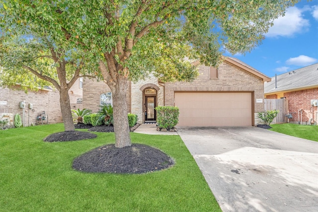 view of front of property with a garage and a front lawn