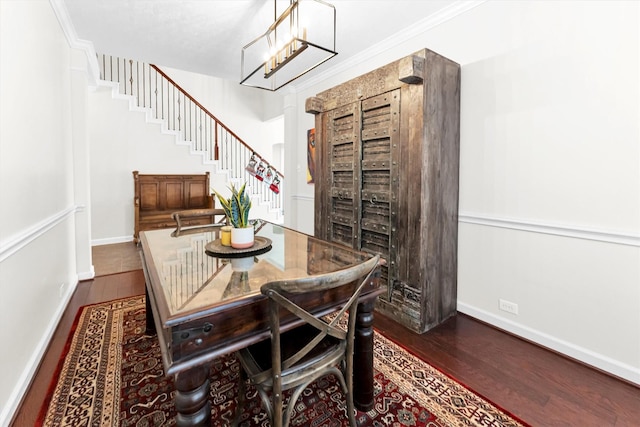 dining space with an inviting chandelier, dark hardwood / wood-style flooring, and crown molding