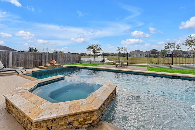 view of swimming pool featuring an in ground hot tub