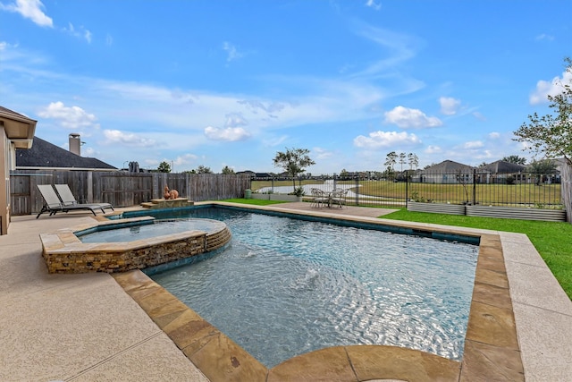 view of swimming pool with a patio and an in ground hot tub