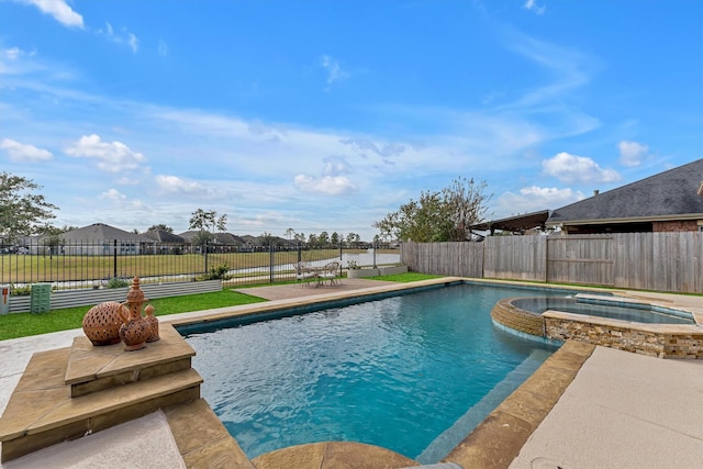 view of swimming pool with an in ground hot tub and a patio