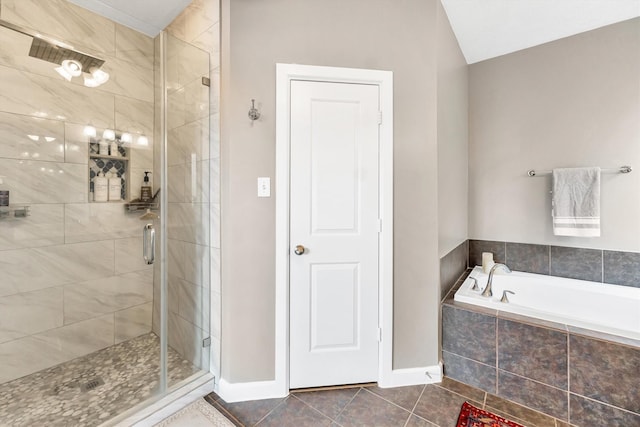 bathroom featuring independent shower and bath and tile patterned flooring