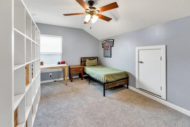 bedroom featuring ceiling fan, lofted ceiling, and carpet flooring