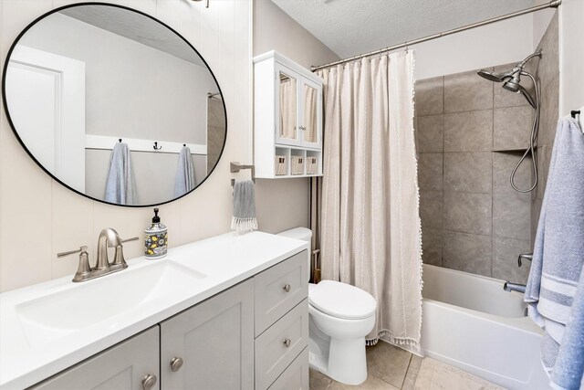 full bathroom featuring toilet, vanity, tile patterned flooring, shower / bathtub combination with curtain, and a textured ceiling