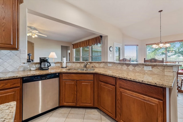 kitchen featuring decorative backsplash, kitchen peninsula, vaulted ceiling, sink, and dishwasher